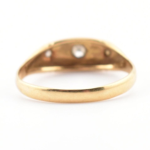 22 - A cased hallmarked 18ct gold and diamond ring. The ring set with three graduating round cut diamonds... 