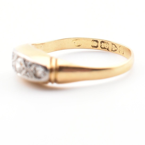 22 - A cased hallmarked 18ct gold and diamond ring. The ring set with three graduating round cut diamonds... 