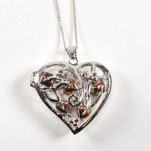 222 - A hallmarked silver Clogau heart locket pendant necklace with fairy. The silver Clogau curb link cha... 