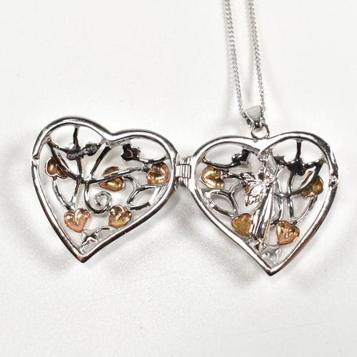 222 - A hallmarked silver Clogau heart locket pendant necklace with fairy. The silver Clogau curb link cha... 