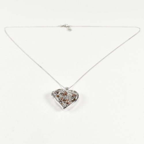 222 - A hallmarked silver Clogau heart locket pendant necklace with fairy. The silver Clogau curb link cha... 