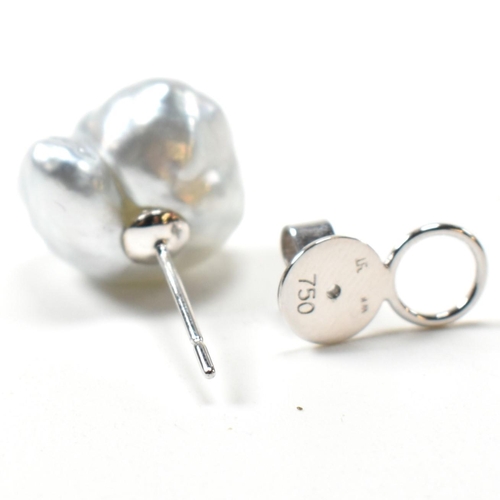 225 - A pair of baroque pearl and 18ct white gold stud earrings. The earrings having baroque pearls surmou... 