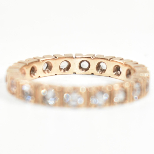 229 - A 9ct rose gold and diamond eternity ring. The ring set all around with round cut diamonds. Marked 9... 