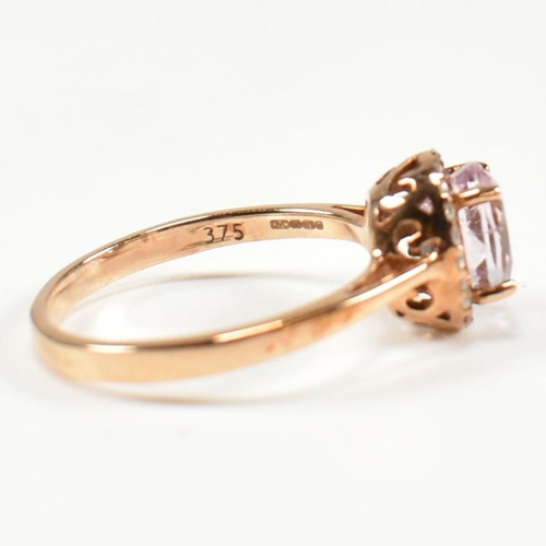 231 - A hallmarked 9ct gold kunzite and diamond cluster ring. The ring set with a four claw set oval cut k... 