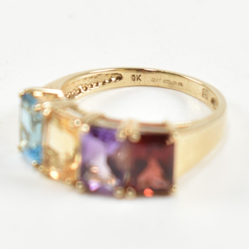 235 - A hallmarked 9ct gold, garnet, amethyst, citrine and topaz ring. The ring set with a row of emerald ... 