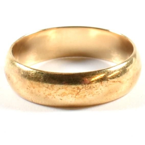 241 - A hallmarked 9ct gold band ring. The gold band ring hallmarked for London. Size Q.5. Weighs 4.4g. Al... 