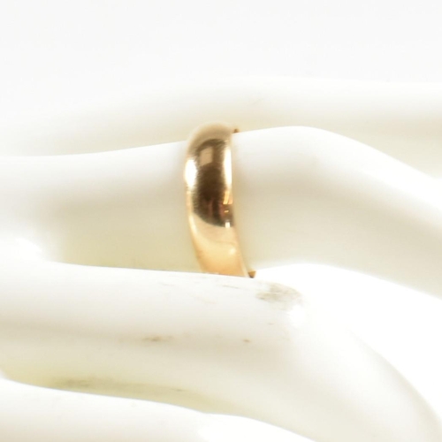 241 - A hallmarked 9ct gold band ring. The gold band ring hallmarked for London. Size Q.5. Weighs 4.4g. Al... 