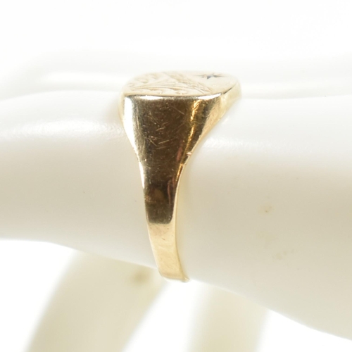 242 - A hallmarked 9ct gold and diamond engraved signet ring. The signet ring having a half engraved squar... 