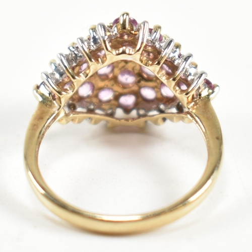 244 - A hallmarked 9ct gold, pink sapphire and diamond cluster ring. The ring set with a cluster of gradua... 