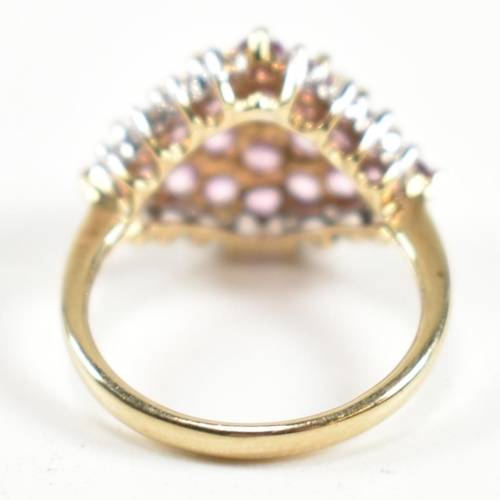 244 - A hallmarked 9ct gold, pink sapphire and diamond cluster ring. The ring set with a cluster of gradua... 