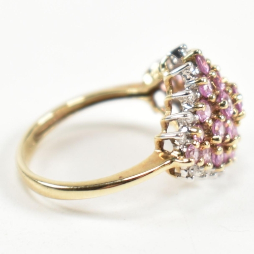 244 - A hallmarked 9ct gold, pink sapphire and diamond cluster ring. The ring set with a cluster of gradua... 