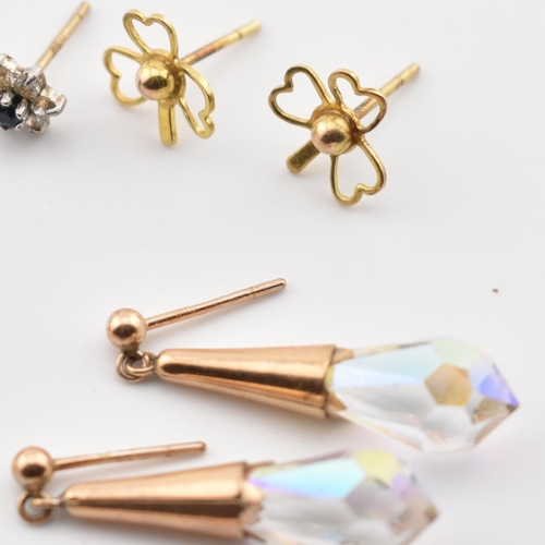 246 - A collection of 9ct gold and gem set earrings. The lot to include a pair of 9ct gold hoop earrings, ... 