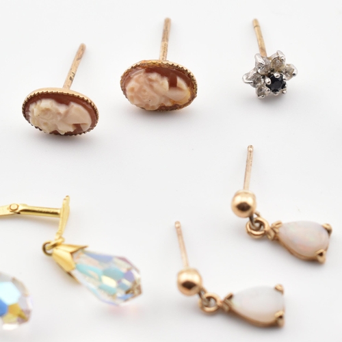 246 - A collection of 9ct gold and gem set earrings. The lot to include a pair of 9ct gold hoop earrings, ... 