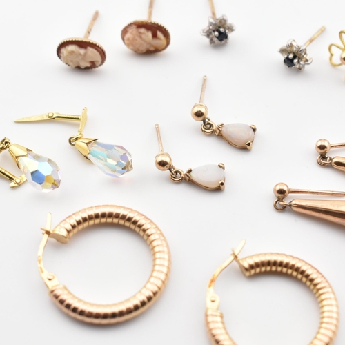 246 - A collection of 9ct gold and gem set earrings. The lot to include a pair of 9ct gold hoop earrings, ... 