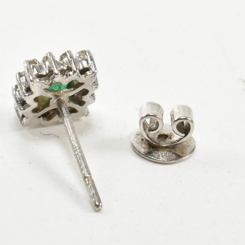 251 - A pair of white gold emerald and diamond cluster earrings. Butterfly fasteners marked 585. Weight 3.... 