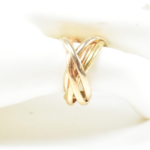 253 - An Italian 18ct gold five band puzzle ring. The ring formed with subtle graduating colours of gold. ... 