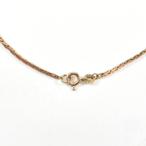 254 - A hallmarked 9ct gold foxtail chain necklace. The 9ct gold necklace having foxtail link to spring ri... 