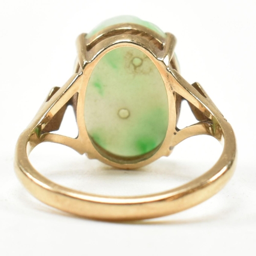 258 - A hallmarked 9ct gold and carved jade dress ring. Hallmarked for Birmingham. Size L.5. Weighs 3.3g. ... 