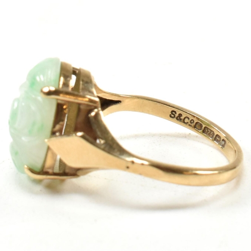 258 - A hallmarked 9ct gold and carved jade dress ring. Hallmarked for Birmingham. Size L.5. Weighs 3.3g. ... 