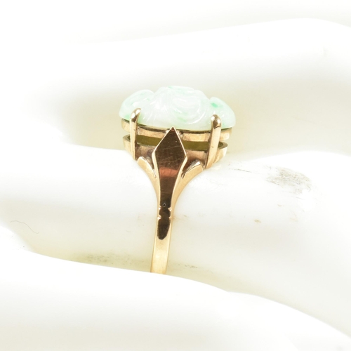 258 - A hallmarked 9ct gold and carved jade dress ring. Hallmarked for Birmingham. Size L.5. Weighs 3.3g. ... 