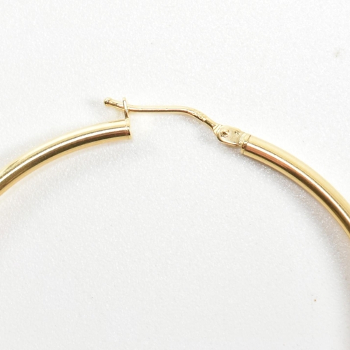 262 - Two pairs of 9ct gold tube hoop earrings. The earrings to include a pair of Italian hallmarked 9ct g... 