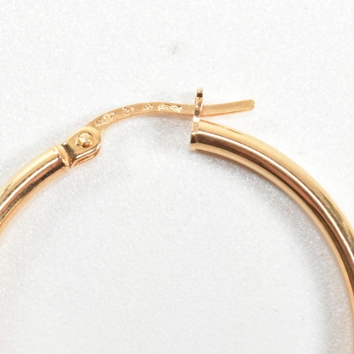 262 - Two pairs of 9ct gold tube hoop earrings. The earrings to include a pair of Italian hallmarked 9ct g... 