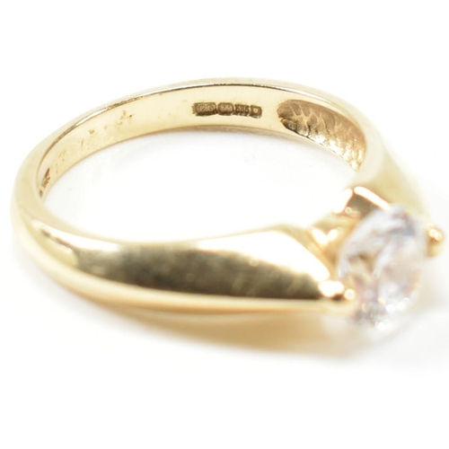 263 - A hallmarked 14ct gold and CZ solitaire ring. The ring set with a single round cut CZ with pinched s... 