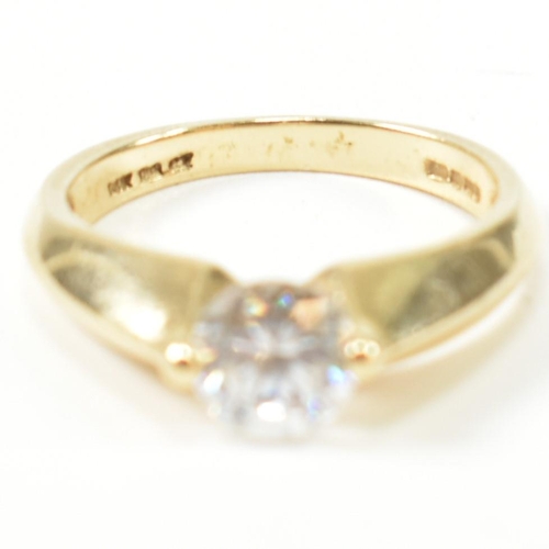 263 - A hallmarked 14ct gold and CZ solitaire ring. The ring set with a single round cut CZ with pinched s... 