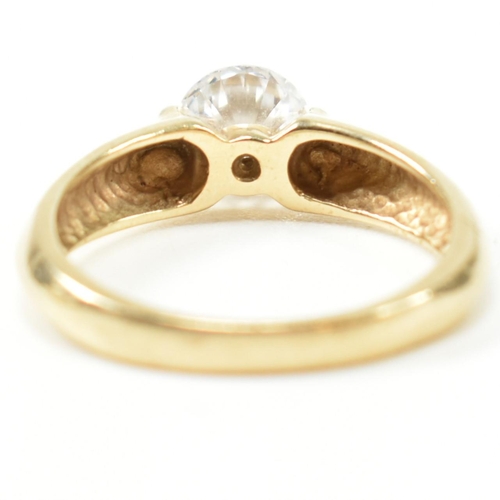 263 - A hallmarked 14ct gold and CZ solitaire ring. The ring set with a single round cut CZ with pinched s... 