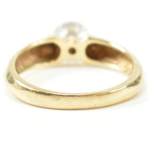 263 - A hallmarked 14ct gold and CZ solitaire ring. The ring set with a single round cut CZ with pinched s... 