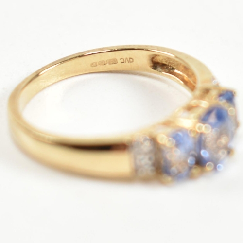 266 - A hallmarked 9ct gold, sapphire and diamond trilogy ring. The ring set with three graduating oval cu... 