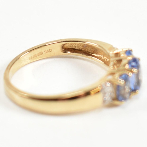 266 - A hallmarked 9ct gold, sapphire and diamond trilogy ring. The ring set with three graduating oval cu... 