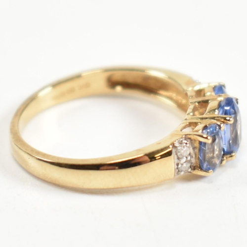 266 - A hallmarked 9ct gold, sapphire and diamond trilogy ring. The ring set with three graduating oval cu... 