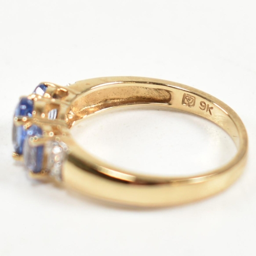 266 - A hallmarked 9ct gold, sapphire and diamond trilogy ring. The ring set with three graduating oval cu... 