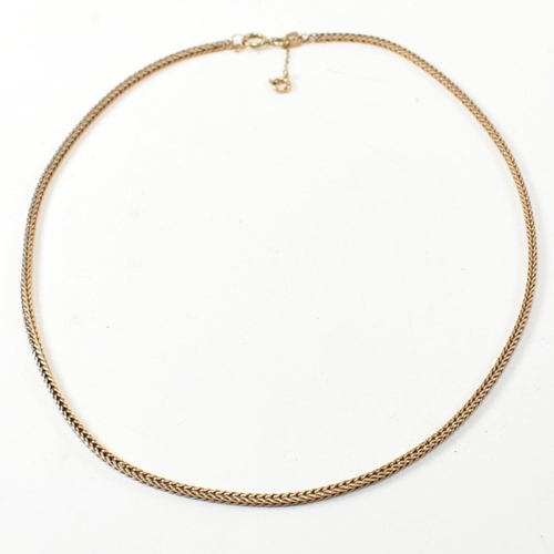 267 - A hallmarked 9ct gold foxtail chain necklace. The 9ct gold necklace having foxtail chain links to sp... 