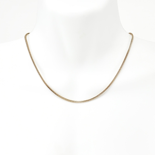 267 - A hallmarked 9ct gold foxtail chain necklace. The 9ct gold necklace having foxtail chain links to sp... 