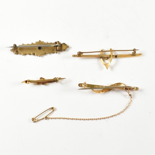 268 - A collection of antique 9ct gold and yellow metal brooch pins. The four brooches to include a hallma... 