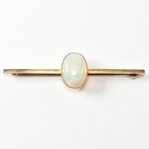 271 - An early 20th century 15ct gold and opal brooch pin. The brooch set with an oval opal cabochon to ba... 