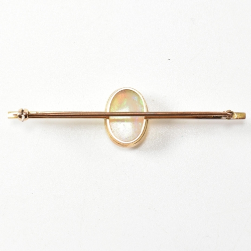 271 - An early 20th century 15ct gold and opal brooch pin. The brooch set with an oval opal cabochon to ba... 