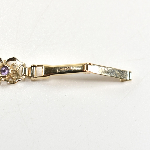 273 - A hallmarked 9ct gold Sovereign wristwatch set with purple stones. The Sovereign ladies wrist watch ... 