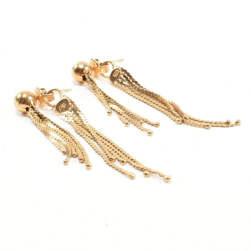 276 - A pair of 18ct gold tassel earrings. The earrings marked 750 with makers mark. Weight 4.8g. Measures... 