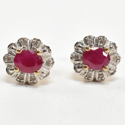 278 - A pair of 9ct gold, ruby and diamond cluster stud earrings. The 9ct gold stud earrings having a cent... 