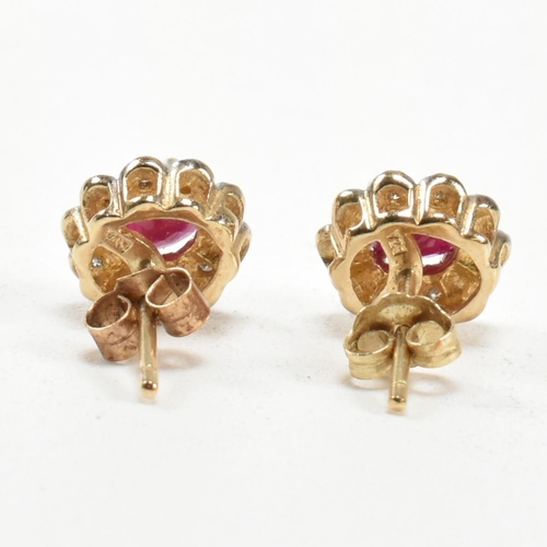 278 - A pair of 9ct gold, ruby and diamond cluster stud earrings. The 9ct gold stud earrings having a cent... 