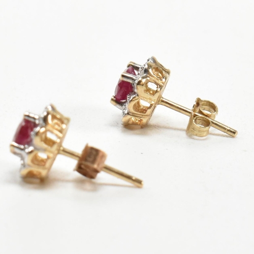 278 - A pair of 9ct gold, ruby and diamond cluster stud earrings. The 9ct gold stud earrings having a cent... 