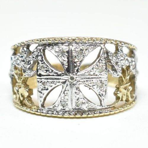 283 - A hallmarked 9ct gold and diamond Maltese cross ring. The pierced band ring having a central white g... 