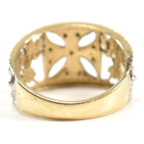 283 - A hallmarked 9ct gold and diamond Maltese cross ring. The pierced band ring having a central white g... 