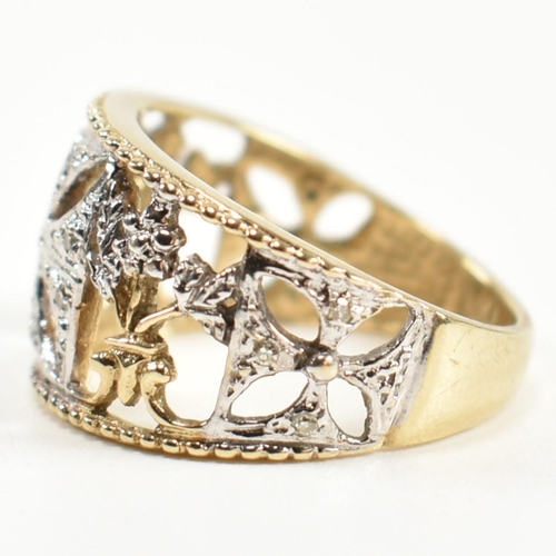 283 - A hallmarked 9ct gold and diamond Maltese cross ring. The pierced band ring having a central white g... 