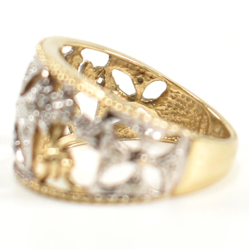 283 - A hallmarked 9ct gold and diamond Maltese cross ring. The pierced band ring having a central white g... 