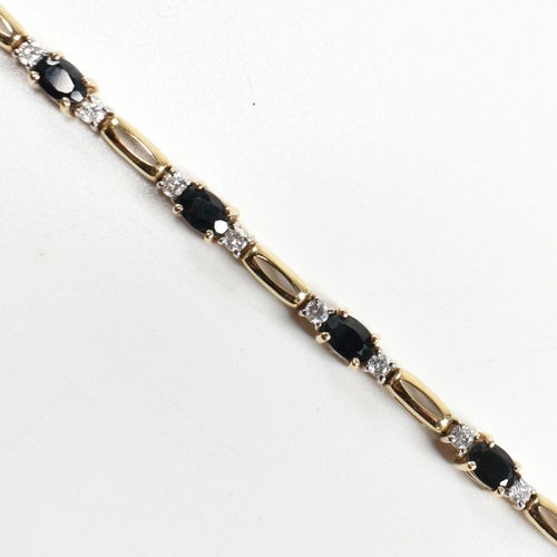 286 - A 9ct gold, sapphire and CZ line bracelet. The bracelet having links set with nine east-west set ova... 