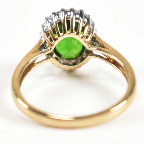 287 - A hallmarked 9ct gold, tourmaline and diamond cluster ring. The ring set with a central oval cut tou... 